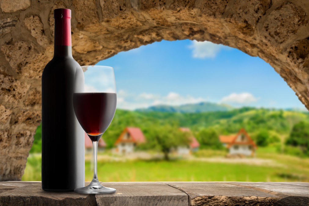 wine glass and bottle near the montenegrin countryside