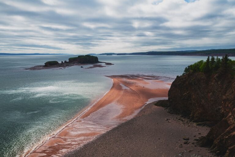 Aerial shot of the Bay of Fundy coastline on a cloudy day.