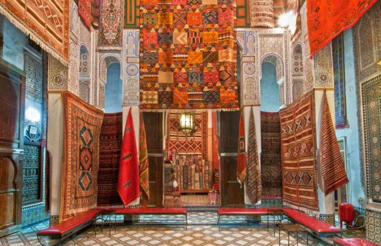 moroccan carpets on display in a shop