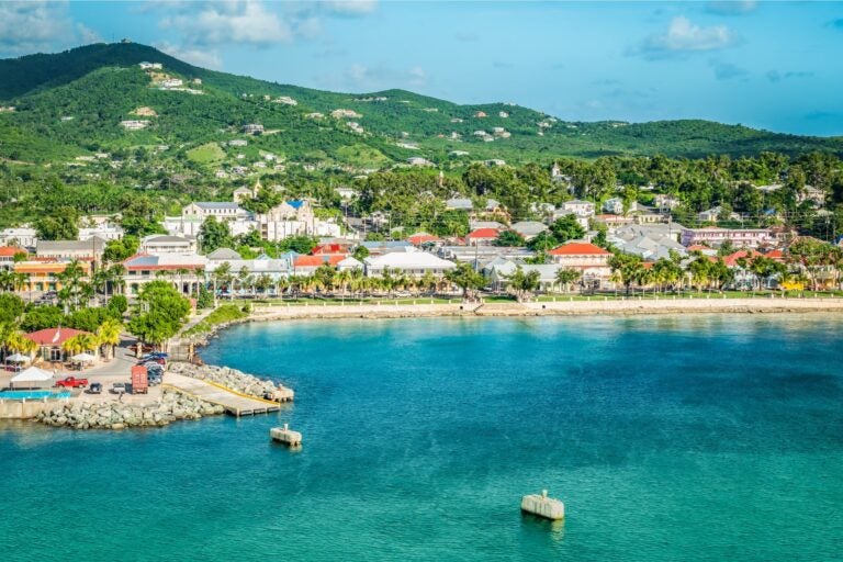 Day time shot of St. Croix, with view of the water, shoreline and mountains.