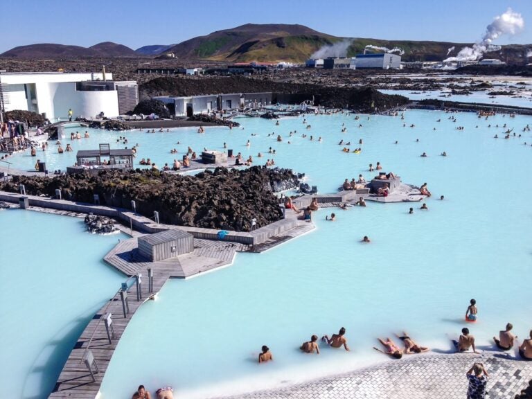 Blue Lagoon during summer months with mountains in the back