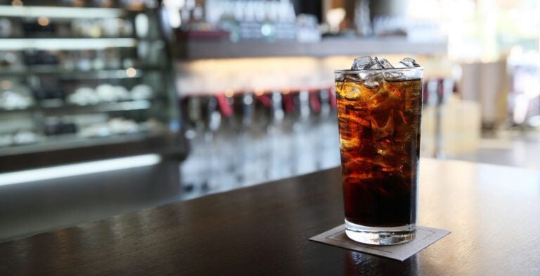 glass of coca cola on a counter
