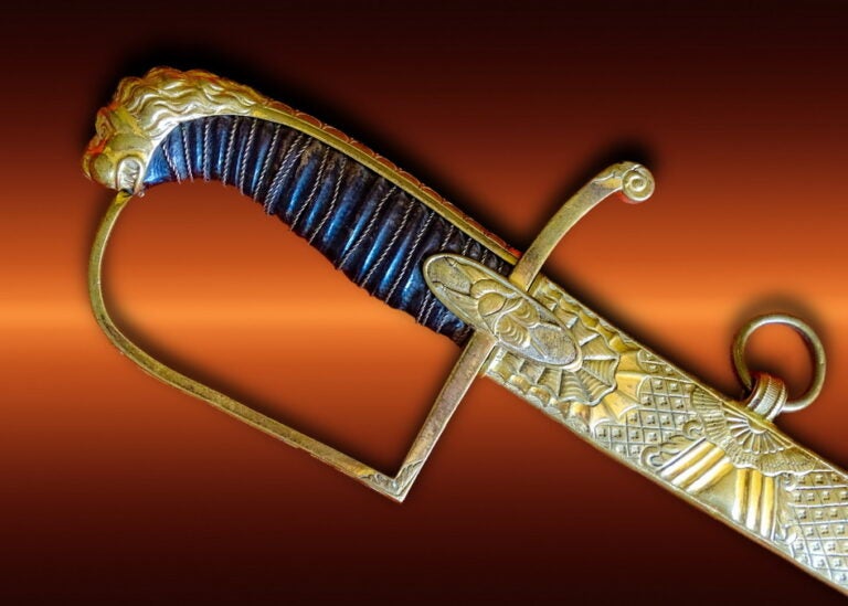 The handle of a gold-encrusted saber 