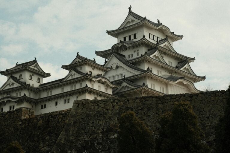 the beautiful white structure of himeji castle in japan with traditional sloping ceilings 