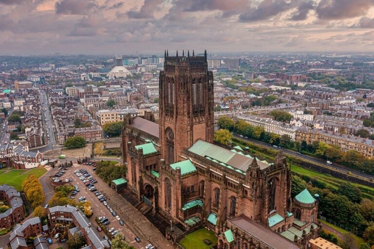 an aerial view of the rustic Liverpool cathedral showcasing the rest of the city as well 