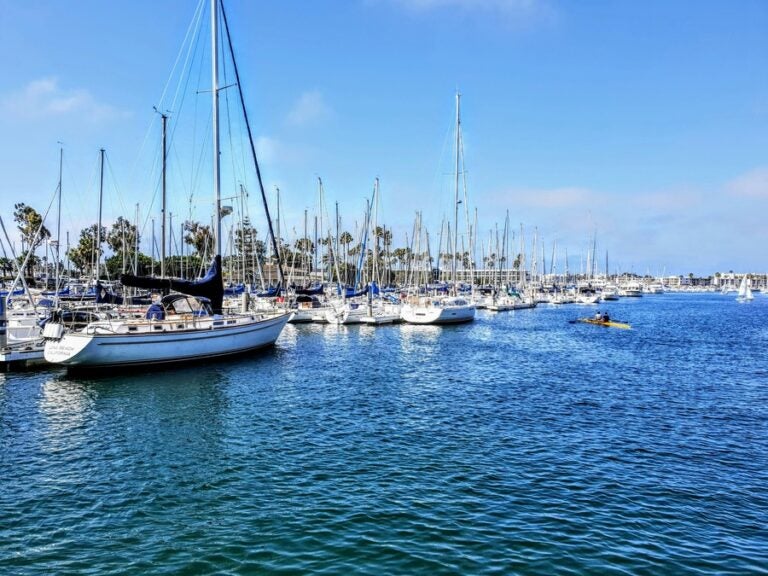 small while boats and yachts on the blue waters of Marina del rey