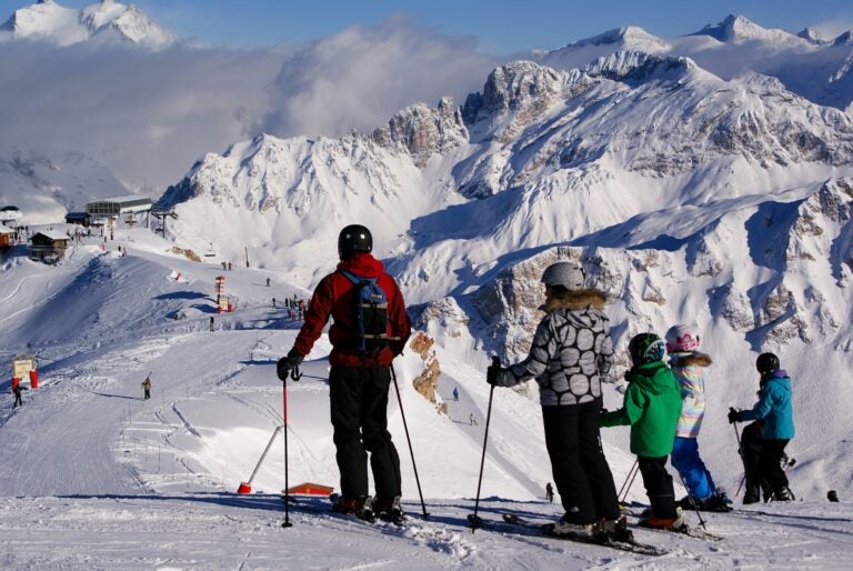 A family skiing in Courchevel.