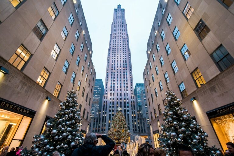 The Rockefeller Center shot from the ground looking up, including the iconic Christmas tree.