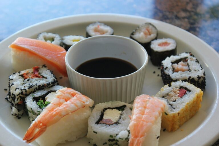 Sushi and soy sauce in a white plate 