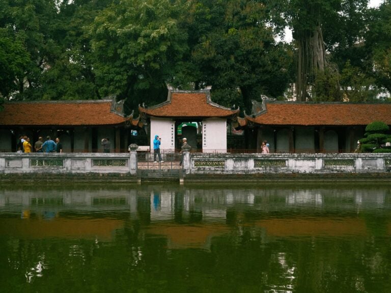 The temple of Literature in Vietnam features a large, square pond.