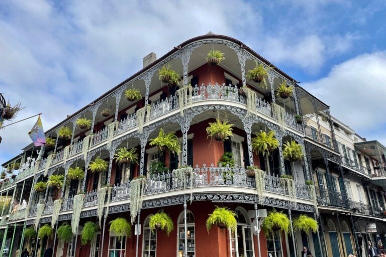 Side view of one of Bourbon Street, New Orleans' famous colonial buildings.