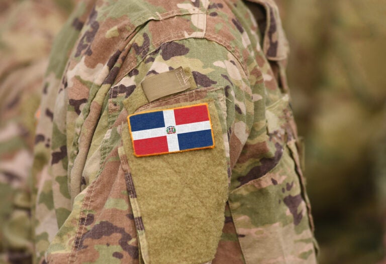 the army camouflage uniform with a Dominican Republic flag on the shoulder area