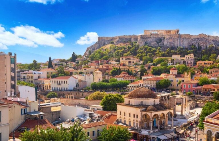 an aerial view of athens with the acropolis on top of the hill