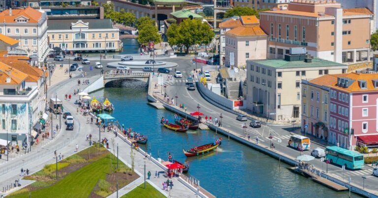 Aveiro with the moliceros on the canals and tourists nearby