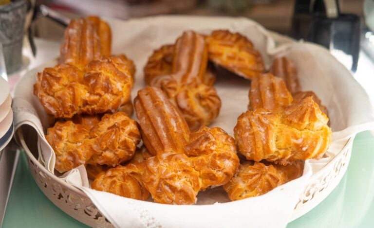 traditional dish, bolos de Sao Goncalo, in a white plate