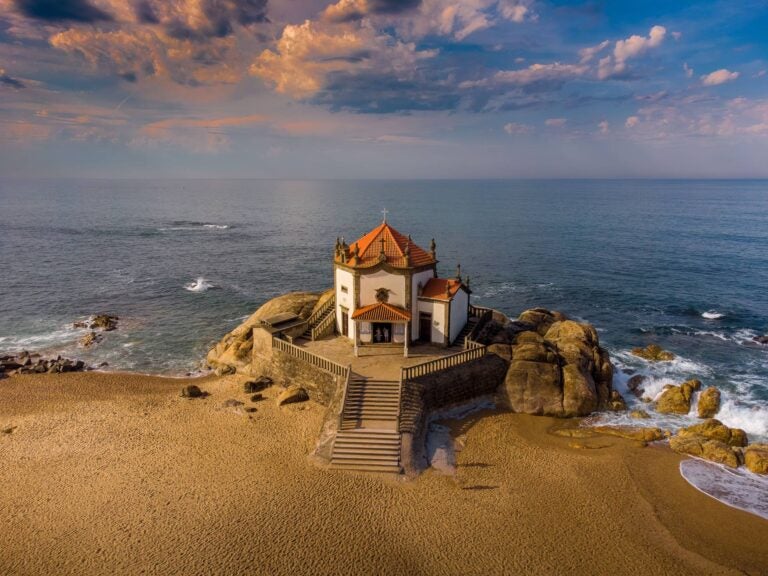 capela do senhor da pedra next to the ocean in a day trip from porto