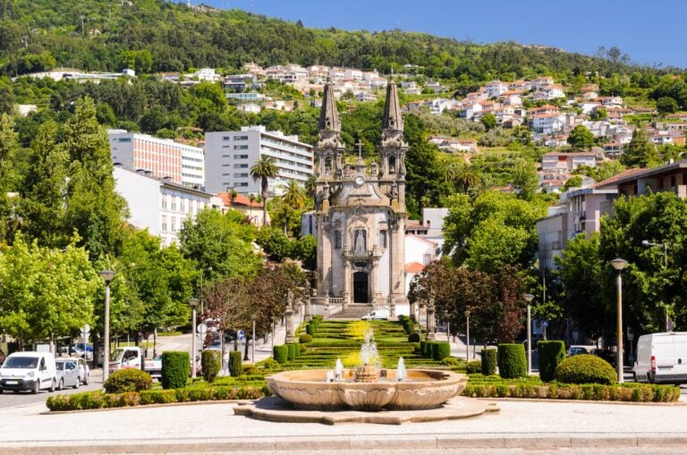 historic church in guimarares with houses in the background