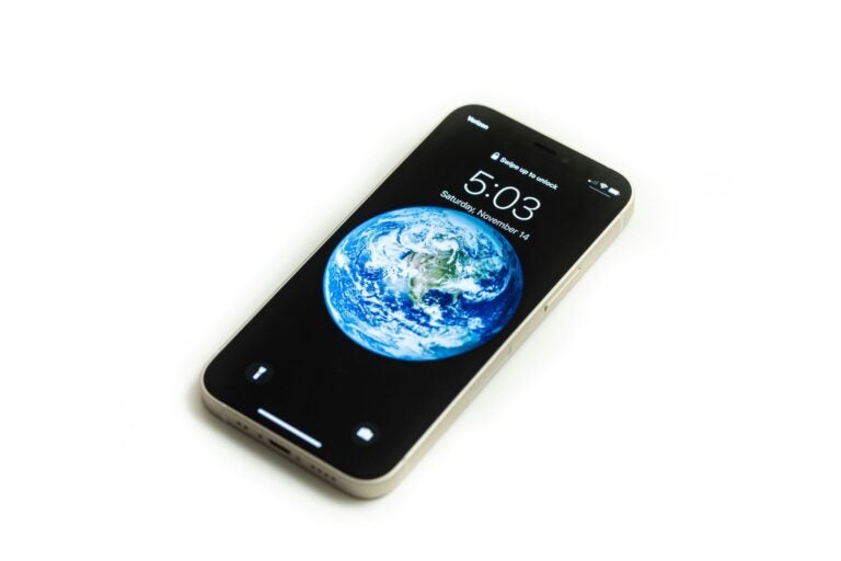 A phone with the world as its screensaver