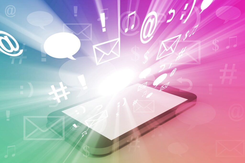 Illustration with a neon pink, green, and blue background of a phone and app icons bursting off the screen.