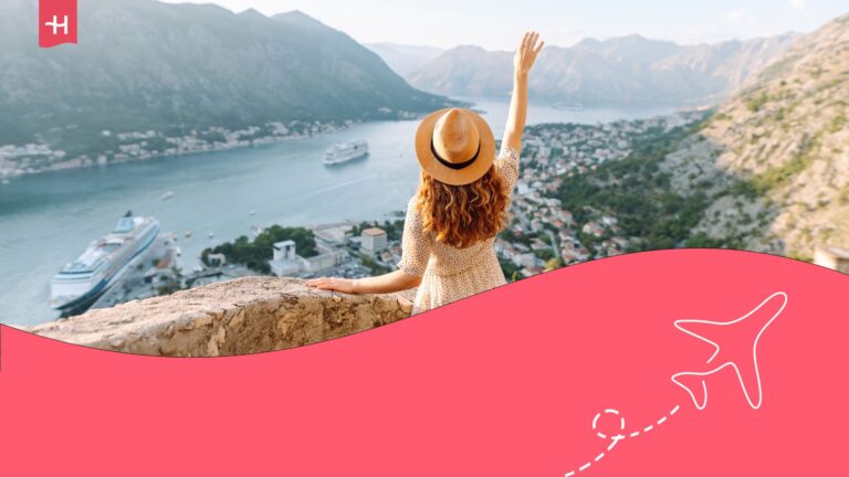 Woman on a bridge facing a mountainous lake with boats. Holafly logo on the top left corner and an aeroplane illusatration on the bottom right corner.