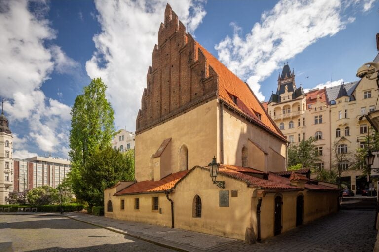 Prague's Jewish Quarter during the day and surrounding buildings and trees.