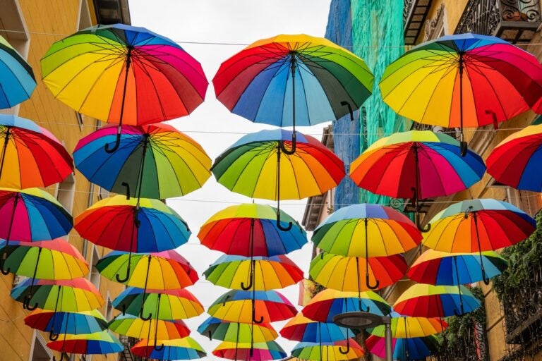 Vew of colorful umbrellas display in the nieghborhood of the Chueca, Madrid.