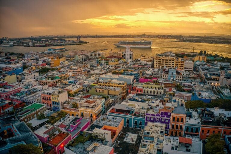Aerial view of the city and port of San Juan, Puerto Rico at dusk.