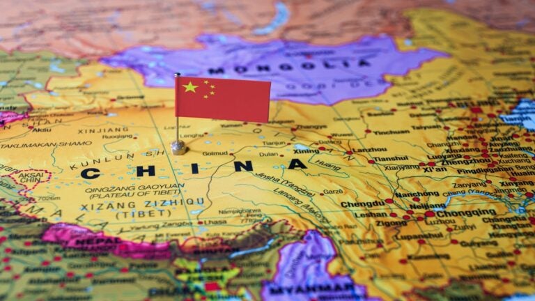 A Chinese flag placed in China on a map