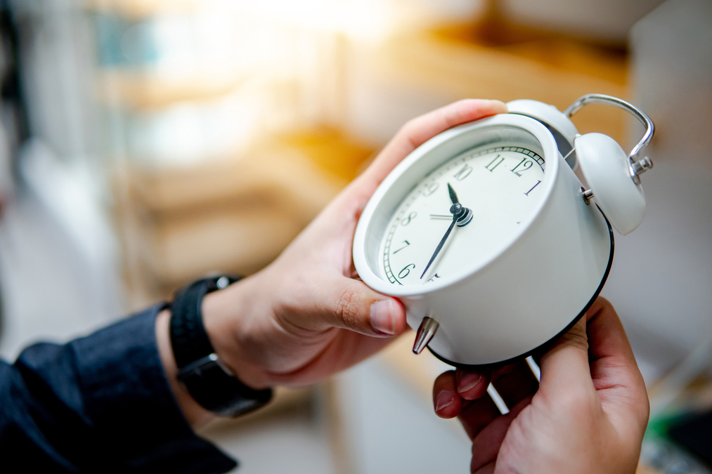 man resetting a clock