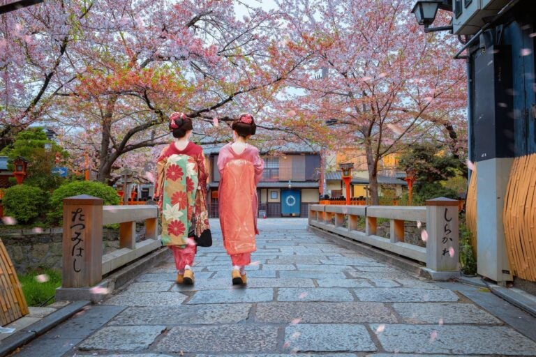 Two geishas walking around gion