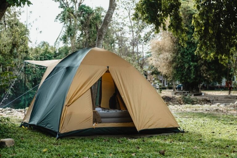 camping tent in the outdoor close to a house