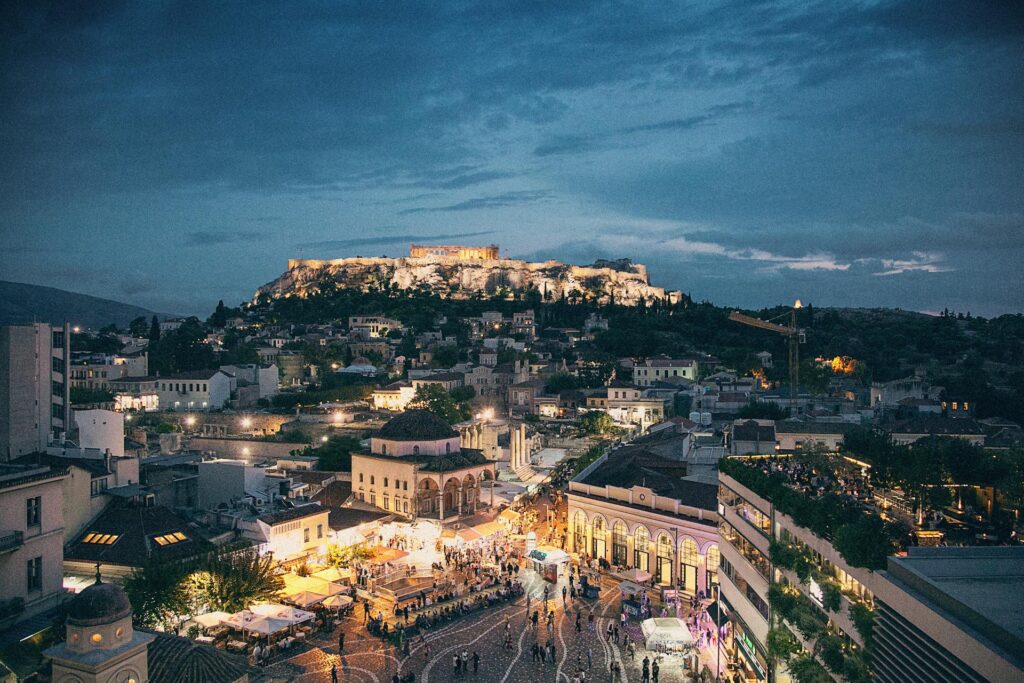 people walking around athens streets at night