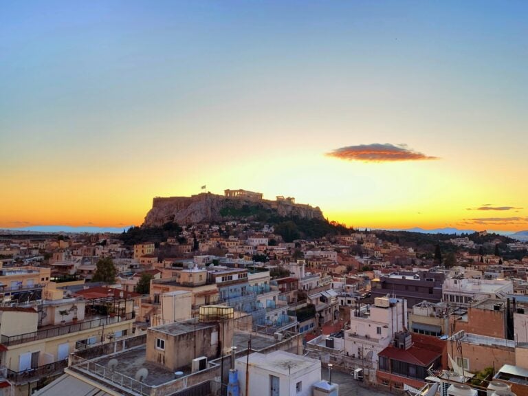 buildings in athens with the parthenon in the background