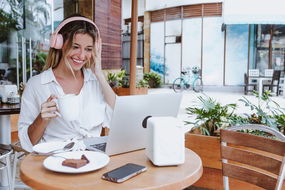 a woman working remotely using a mobile hotspot plan