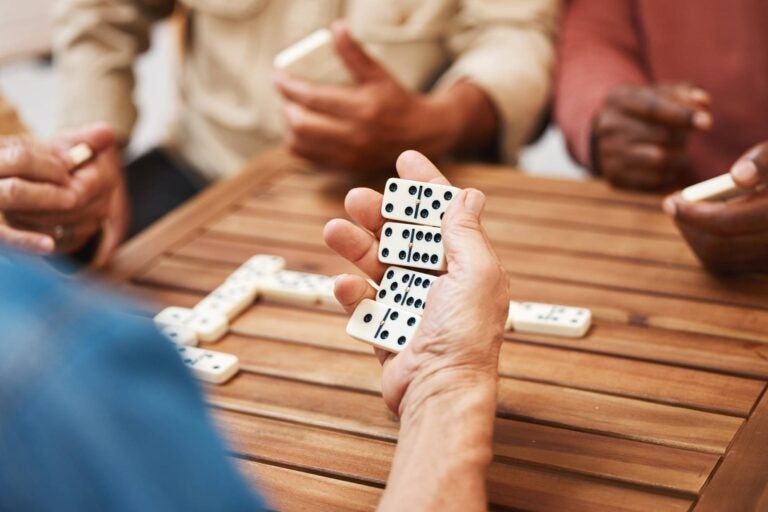 People in Cuba playing dominoes in the street