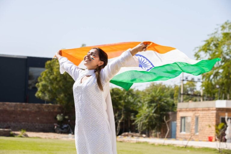 Woman waving an Indian flag