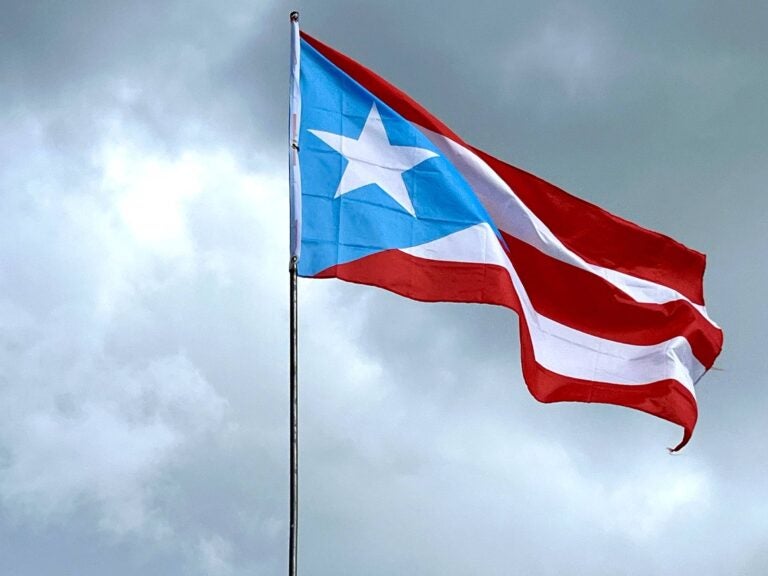Puerto Rican flag waving during a cloudy day