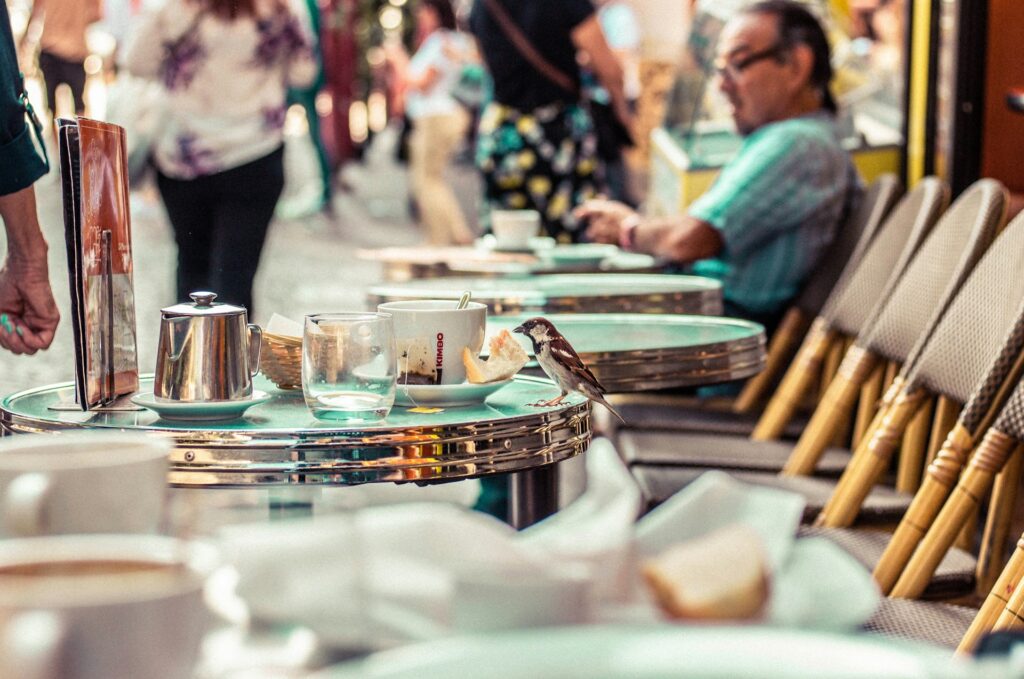 a cup of coffee in an outdoor restaurant in paris