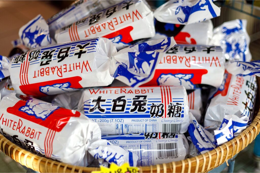 Close-up of the traditional Chinese candy, White Rabbit in a bamboo bowl.