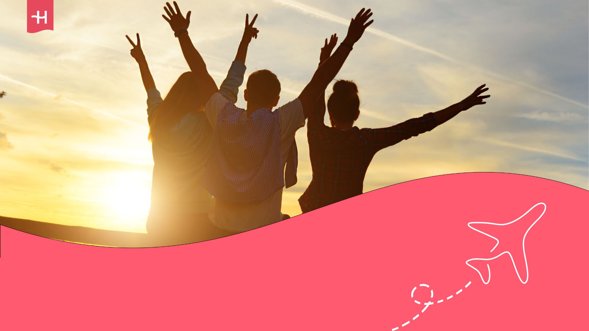 Three people's shadows from behind with their arms raised and the sun setting in front of them.