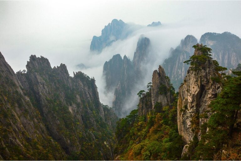 Aerial view of the peaks of Huangshan and surrounding clouds.