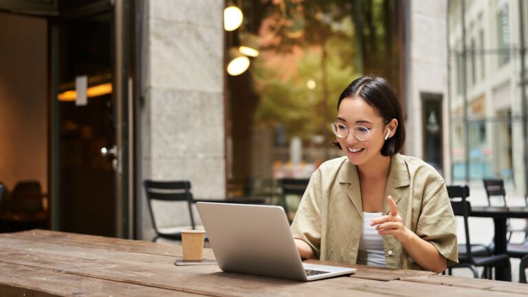 A woman at her laptop in one of the best cities for remote work