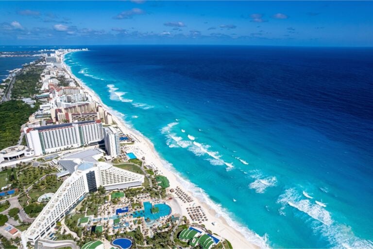 Aerial view of the shoreline of Cancun and hotels.