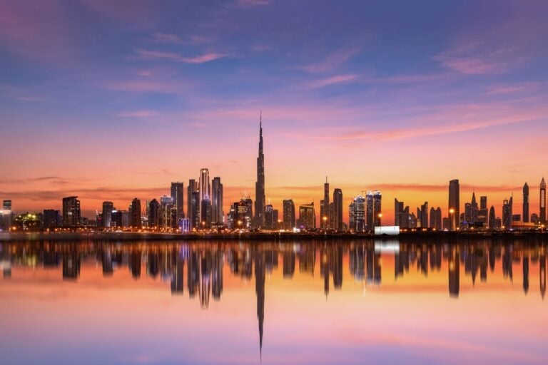 The Dubai skyline at dusk.