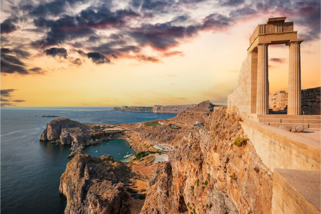 View of ancient ruins, rocky mountains, and the ocean of Rhodes.