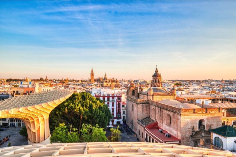 Aerial view of the city of Seville at dusk.