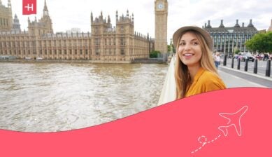 woman standing in front of the clock tower at the Palace of Westminster in London