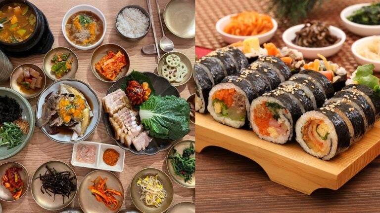 Korean meal with pork, rice, side dishes, and sliced gimbap.