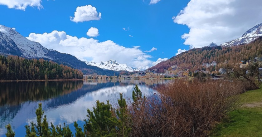 Snow-covered peaks and a lake in St. Moritz.