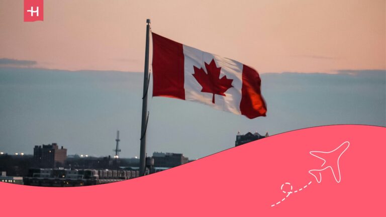flag of Canada with a cityscape in the background